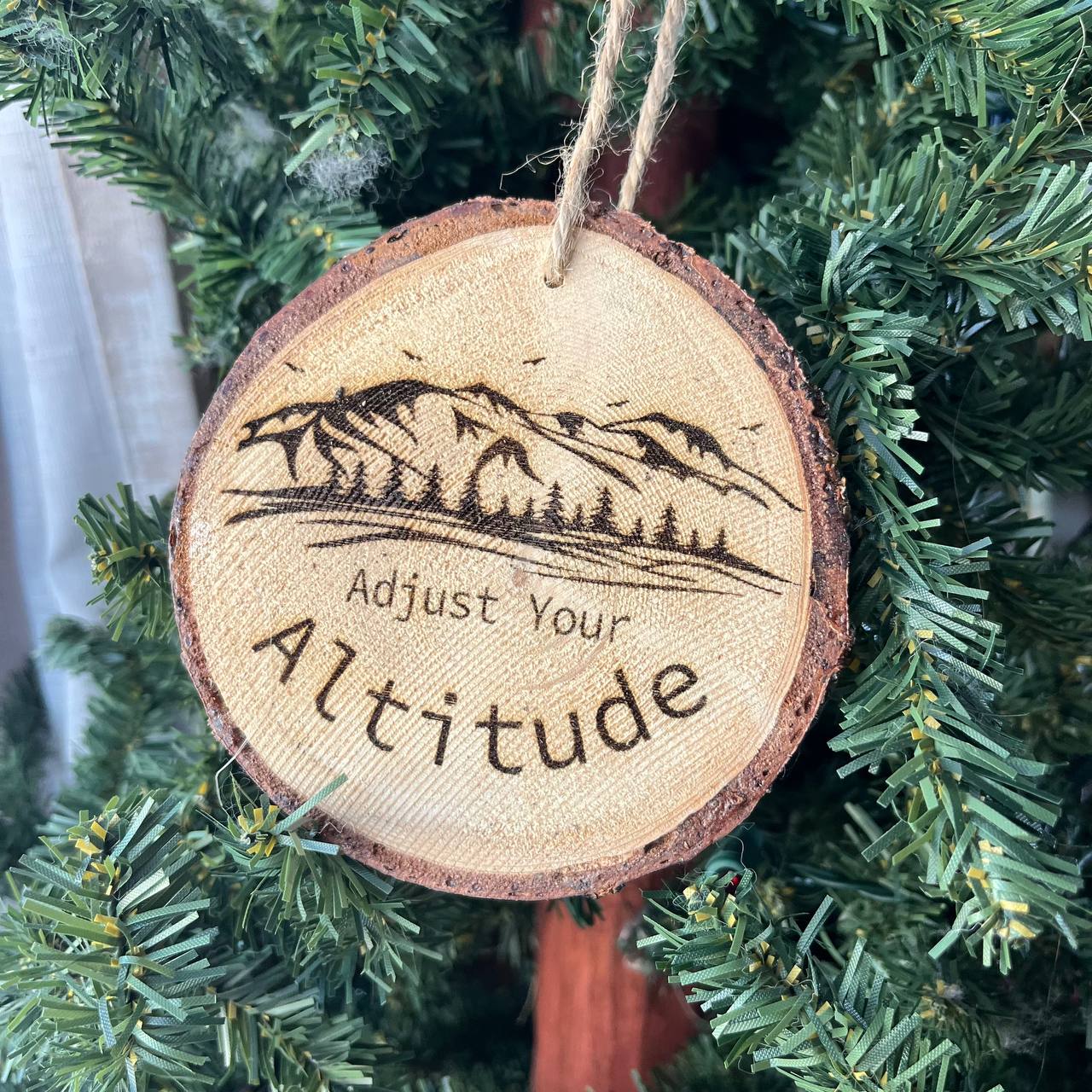 Adjust Your Altitude Engraved Pine Wood Ornament – Rustic Mountain Quote Tree Slice – Locally Sourced 3.25"-4" Round Nature Gift