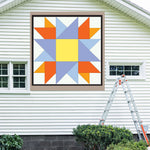 Double Friendship Barn Quilt Pattern displayed on the exterior of a farmhouse, illustrating how the finished painted quilt block looks on a home.