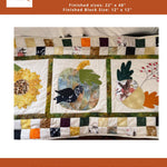 A digital image of a Fall Sampler Mini Quilt, featuring various applique shapes including leaves and flowers on a quilted background. The quilt is marked with the size '22.