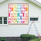 Feather Barn Quilt Pattern displayed on the exterior of a farmhouse, illustrating how the finished painted quilt block looks on a home.