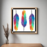 Framed Feathers Barn Quilt Pattern displayed as colorful farmhouse wall art in a modern living room. Printable digital download for DIY painted barn quilts.