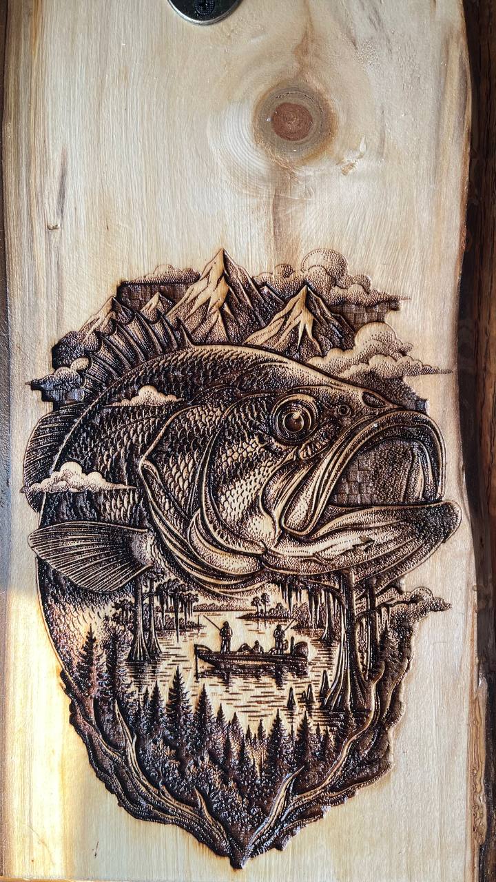 Wooden plaque with engraved fish and nature scene
