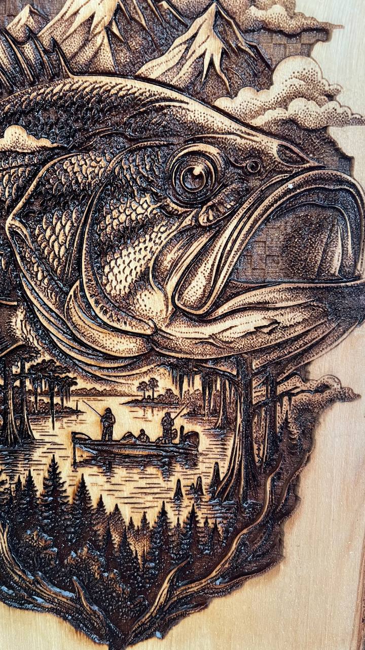 Wooden carving of a fish with a scenic background