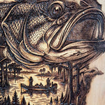 Wooden carving of a fish with a scenic background