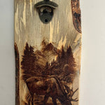 Wooden bottle opener with a moose and forest design on a white background