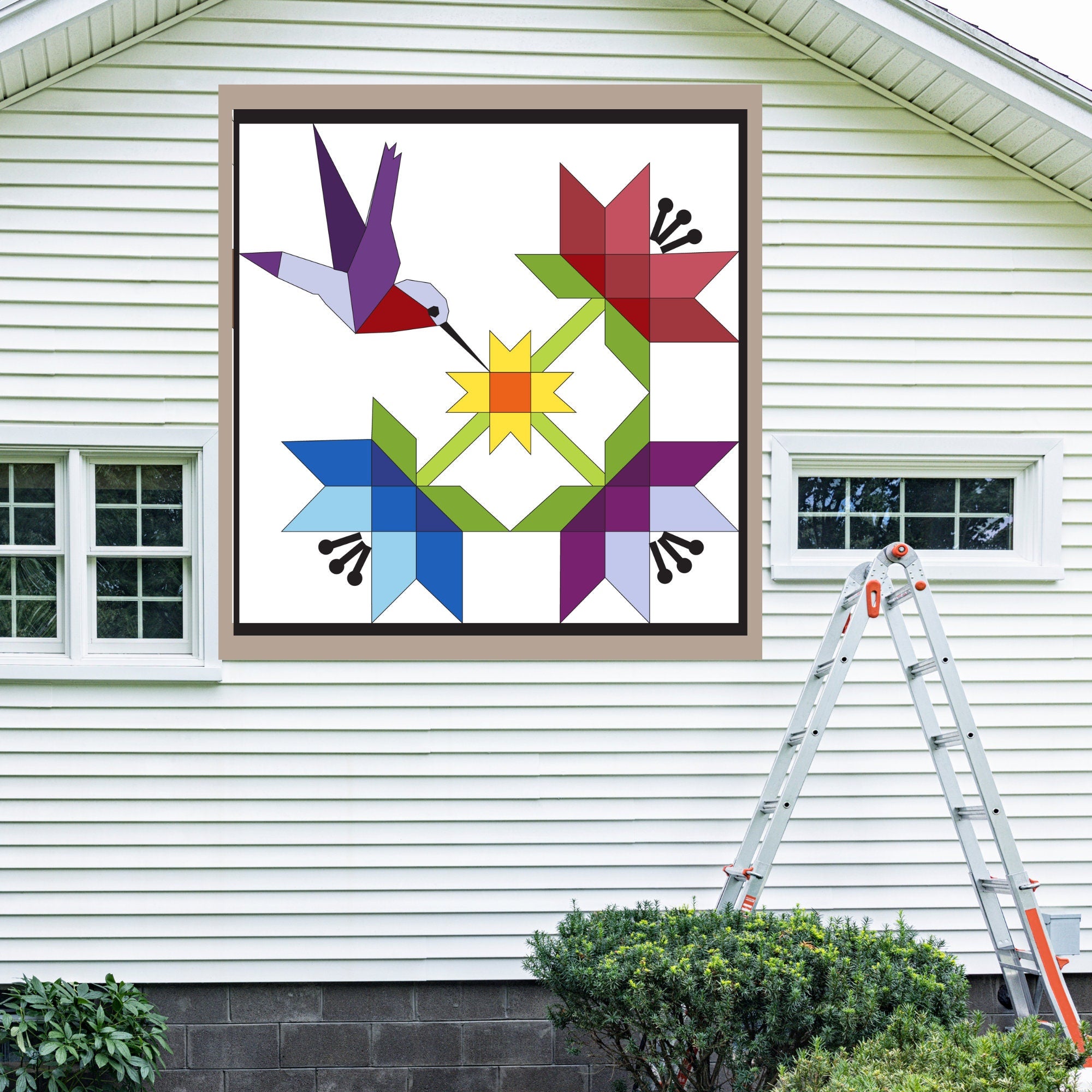 Hummingbird Barn Quilt Pattern displayed on the exterior of a farmhouse, illustrating how the finished painted quilt block looks on a home.