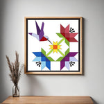 Hummingbird Barn Quilt Pattern displayed as framed farmhouse wall art in a modern living room. Printable digital download for DIY painted barn quilts.