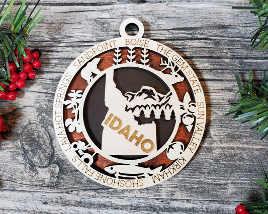 Idaho State Ornament – 3.25” Round Laser Cut Wooden Christmas Ornament | Idaho Gift for Campers, Skiers, Outdoor Adventurers & Gem State Travelers