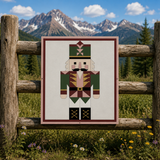 Nutcracker Christmas barn quilt pattern featuring a geometric holiday nutcracker in forest green, burgundy, blush pink, gold, cream and black. Printable DIY barn quilt design for painted wood signs, farmhouse Christmas decor, holiday wall art, porch decorations and handmade seasonal projects.
