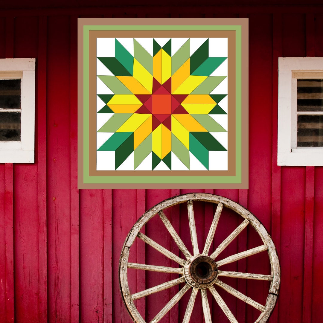 Sunflower Barn Quilt Pattern displayed on a rustic red barn with a vintage wagon wheel, showing the finished painted barn quilt outdoors.