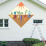 Veggie Garden Barn Quilt Pattern displayed on the exterior of a farmhouse, illustrating how the finished painted quilt block looks on a home.
