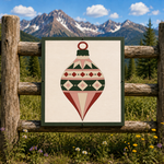 Yuletide Jewel Christmas ornament barn quilt pattern featuring a geometric vintage holiday ornament in evergreen, cream, dusty blush and rich red. Printable DIY barn quilt design for painted wood signs, farmhouse Christmas decor, holiday wall art, porch decorations and handmade Christmas projects.
