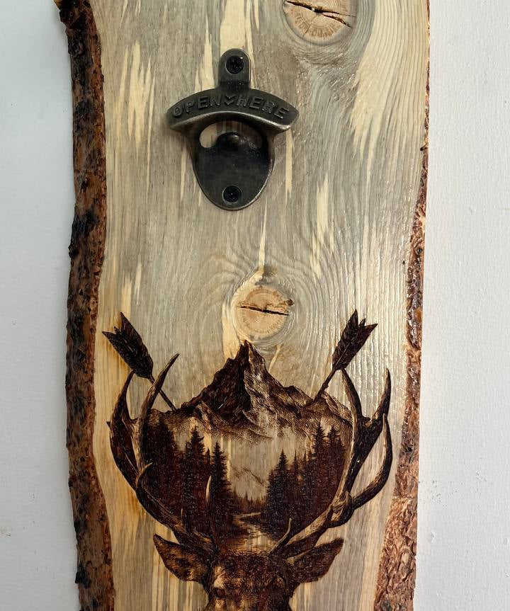 Wooden bottle opener with a deer design on a light gray background