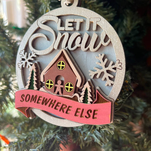 “Let It Snow Somewhere Else” Ornament – 3.5" Round Layered Wood Funny Winter Tree Decor with Cottage & Snowflakes