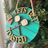 Funny Camping Ornament – “Let’s Get Toasted” S’mores Marshmallow Design – Rustic Campfire Christmas Decor – 3.25" Round