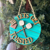 Funny Camping Ornament – “Let’s Get Toasted” S’mores Marshmallow Design – Rustic Campfire Christmas Decor – 3.25" Round