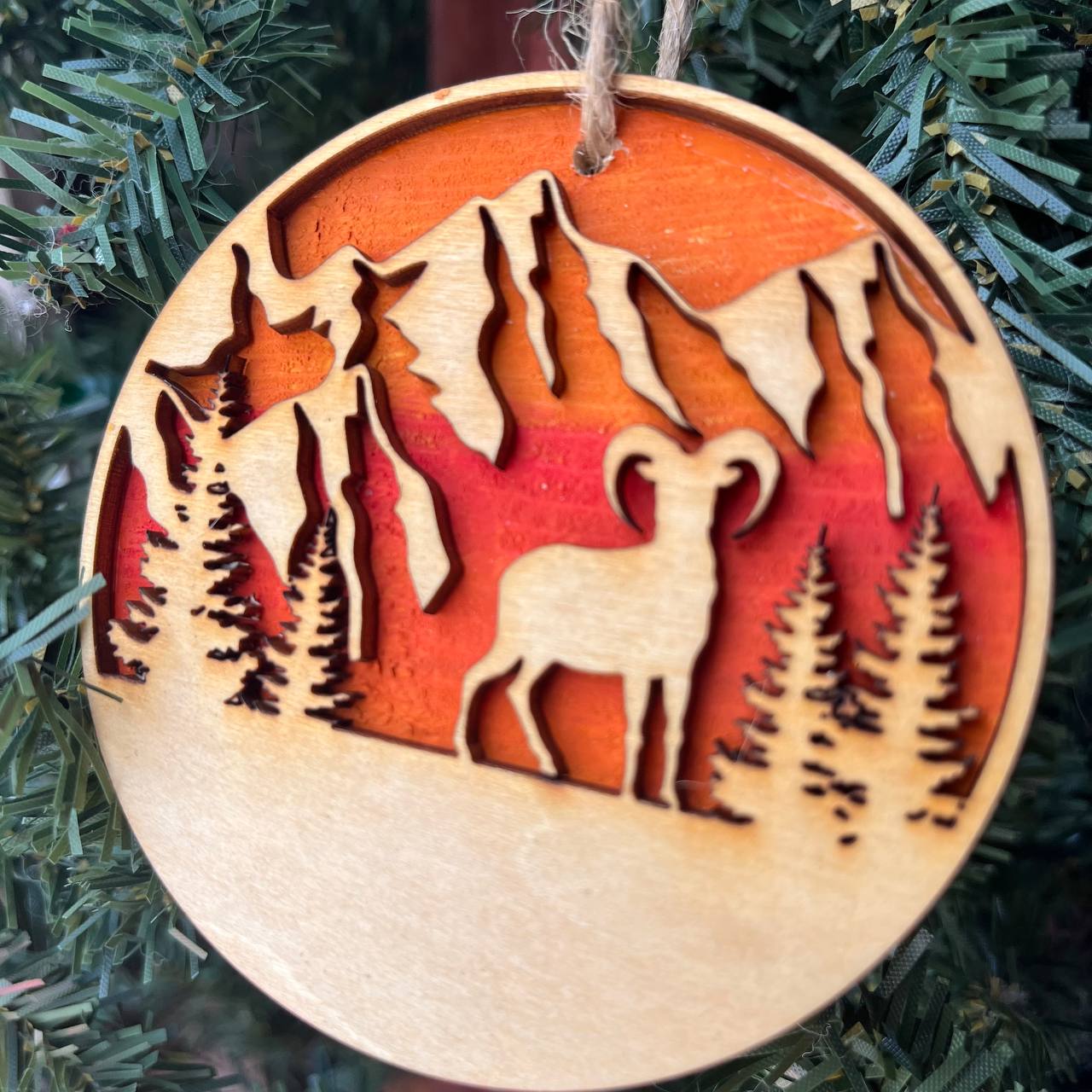 Mountain Goat Ornament – Bighorn Sheep Wooden Christmas Ornament – Nature-Inspired Outdoor Holiday Decor – Layered Sunset Forest Ornament 3.25"