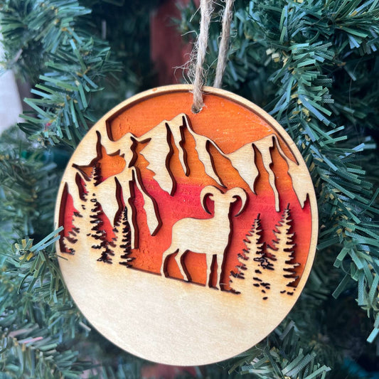 Mountain Goat Ornament – Bighorn Sheep Wooden Christmas Ornament – Nature-Inspired Outdoor Holiday Decor – Layered Sunset Forest Ornament 3.25"