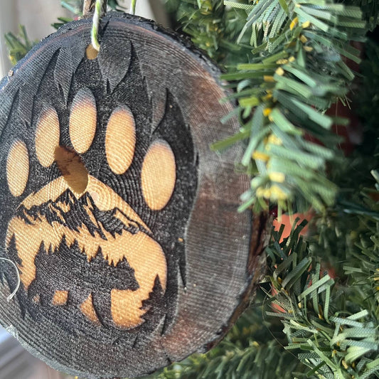 Bear Paw Print Engraved Pine Wood Ornament – Rustic Wildlife Tree Slice Décor – Locally Sourced 3.25"-4" Round Ornament for Nature Lovers