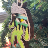 Rustic Bigfoot Christmas Ornament - Hand-Painted 4-Layer Wooden Sasquatch Forest Scene