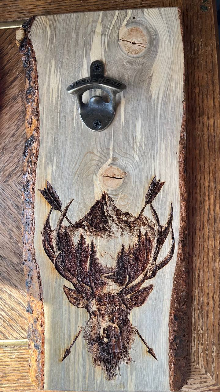 Wooden bottle opener with a deer design on a rustic wooden background